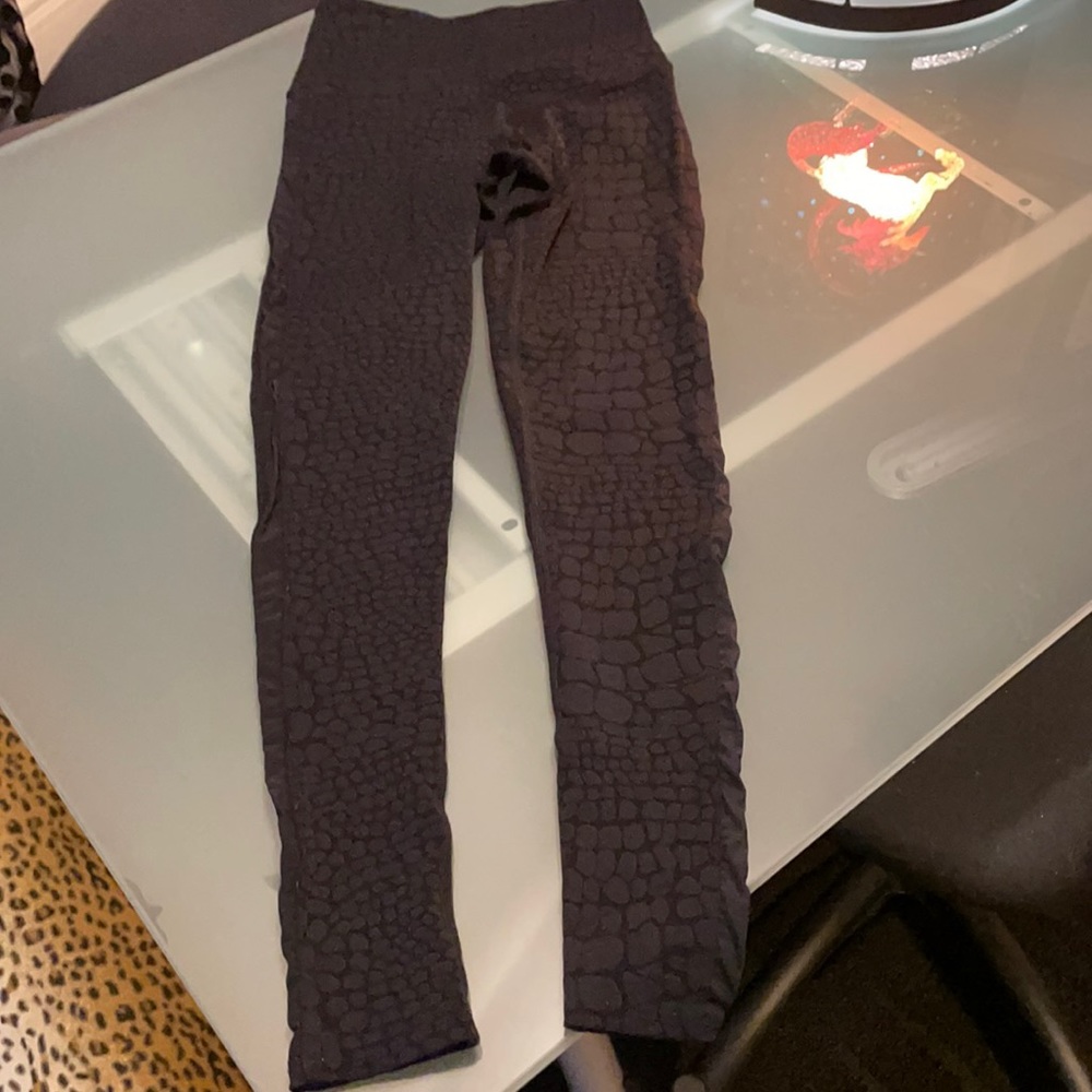 Strut This black leggings; mesh side; animal print